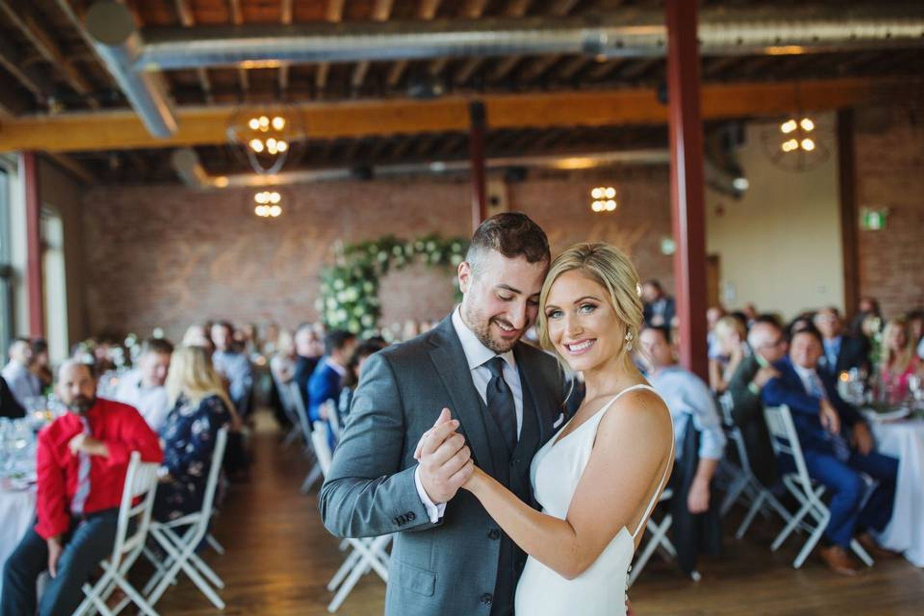 Guests dancing at a River's Edge wedding reception with a professional DJ