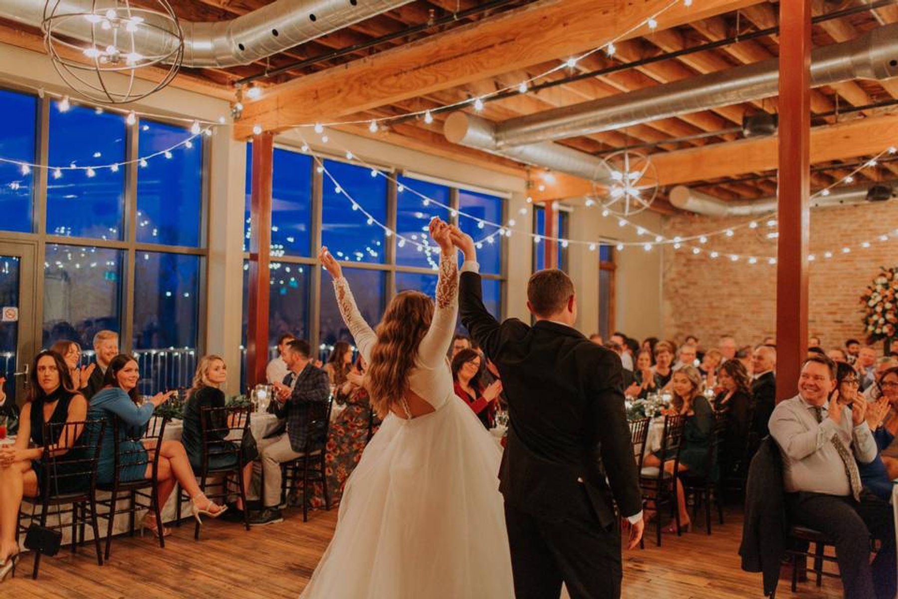 Wedding reception in the historic stone and brick interior of River's Edge in Paris, Ontario